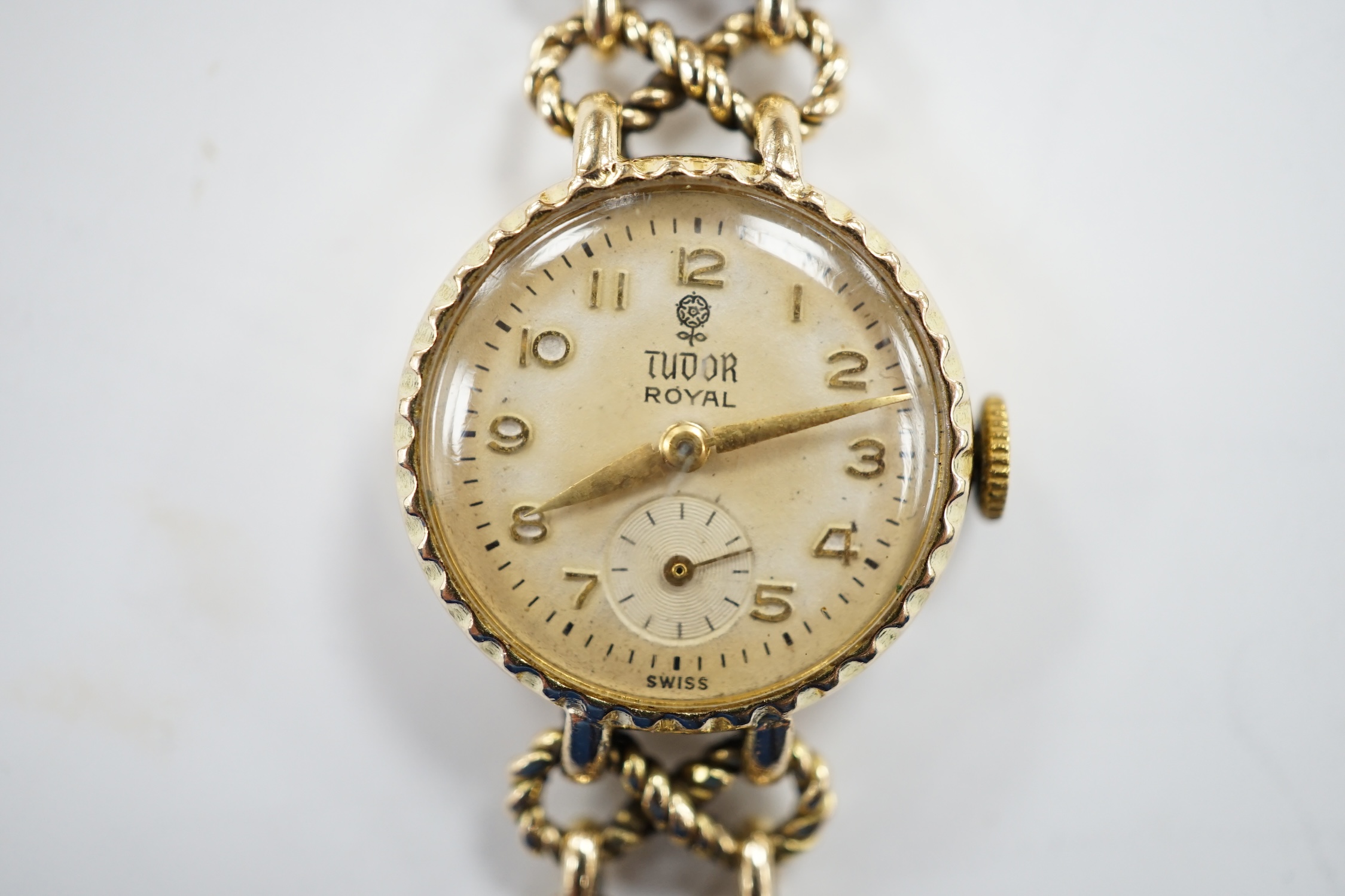 A lady's late 1950's 9ct gold Tudor Royal manual wind wrist watch, on a 9ct gold Rolex bracelet, overall 18.5cm, gross 22 grams, with Rolex box.